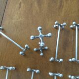 Set of twelve silver metal knife holders signed SFAM