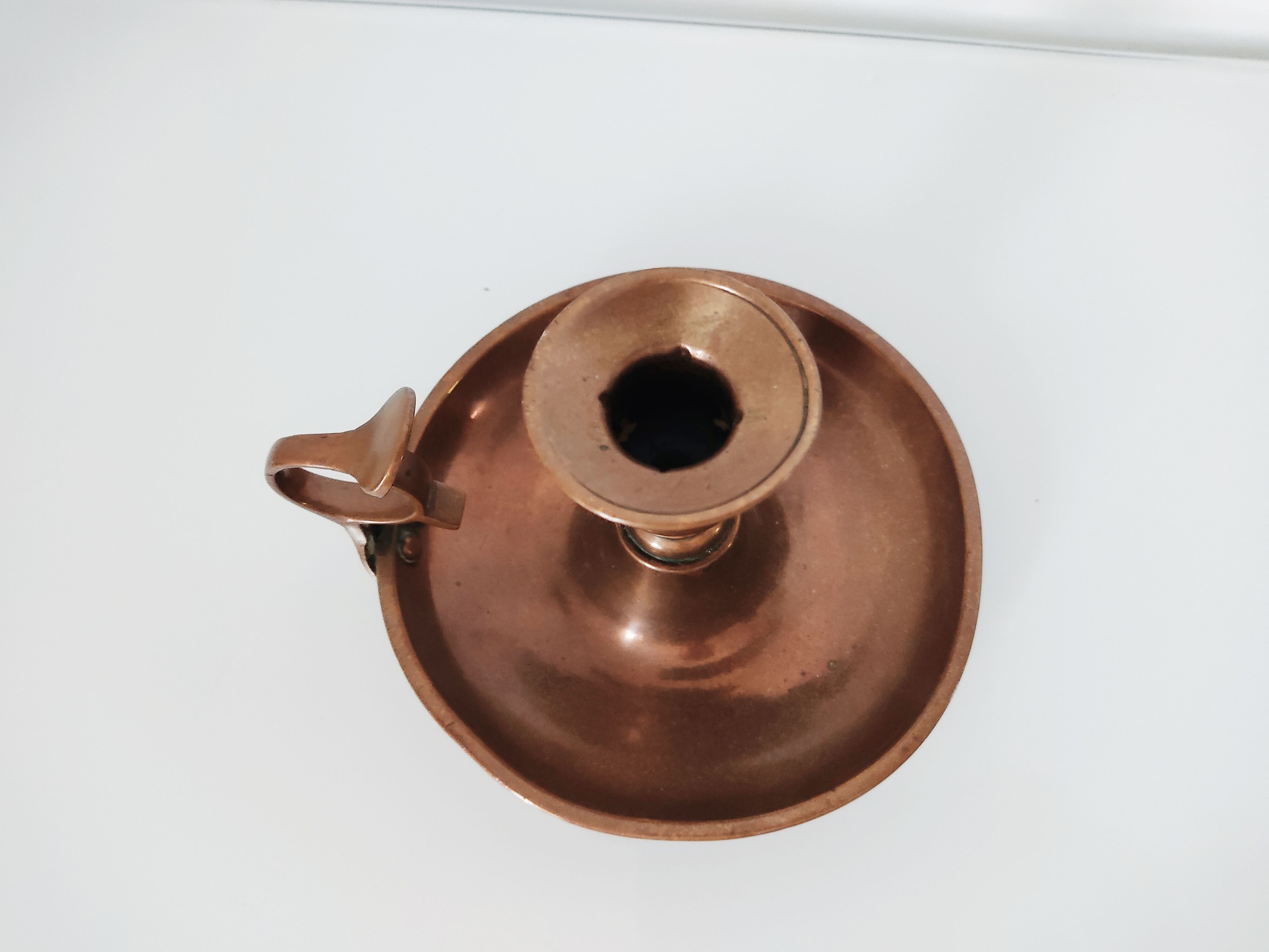 Set of a pair of candle holders and a hand candle holder