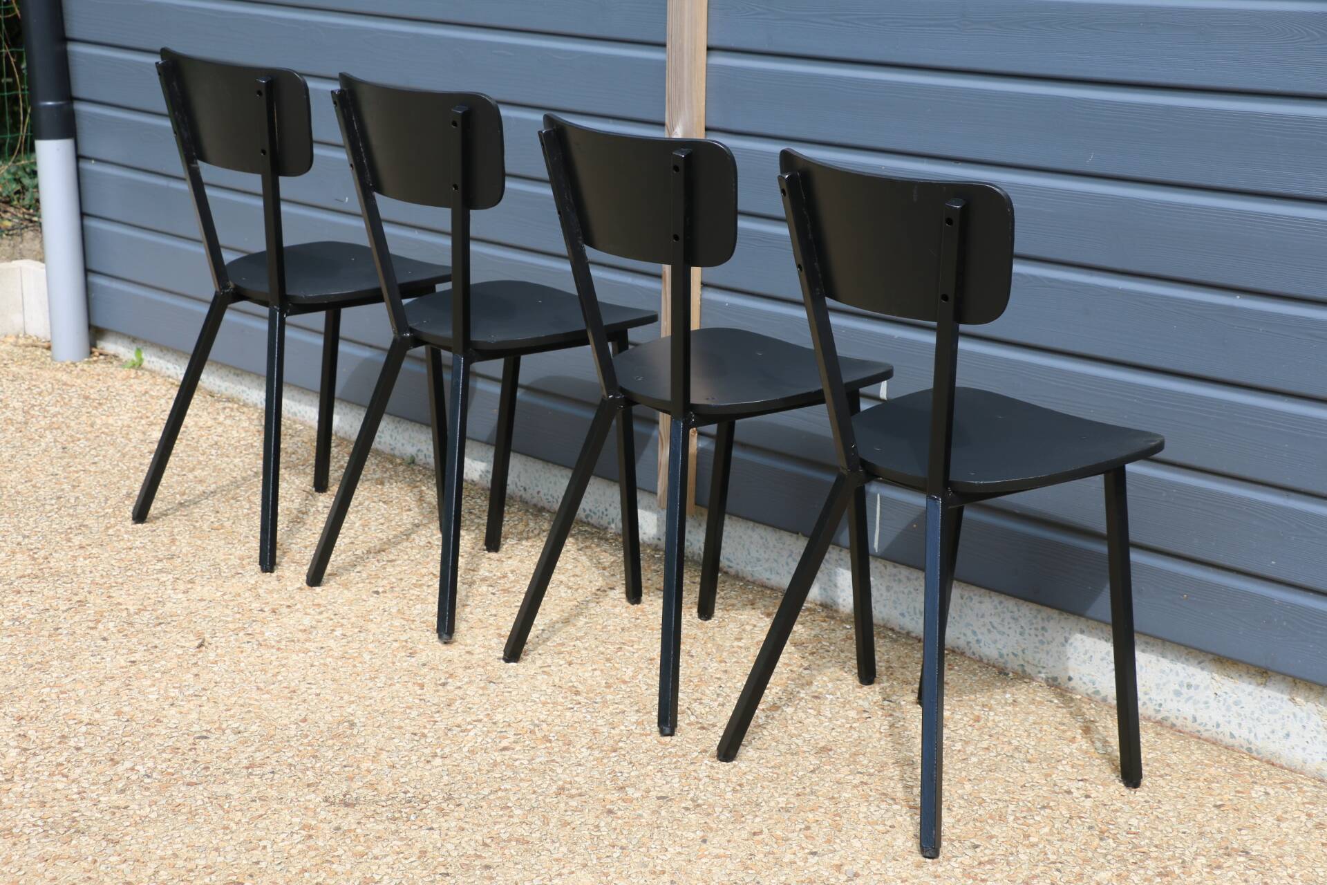 4 black metal and wood chairs