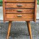 Scandinavian bedside table in oak from the 1960s with tapered legs and 3 drawers.