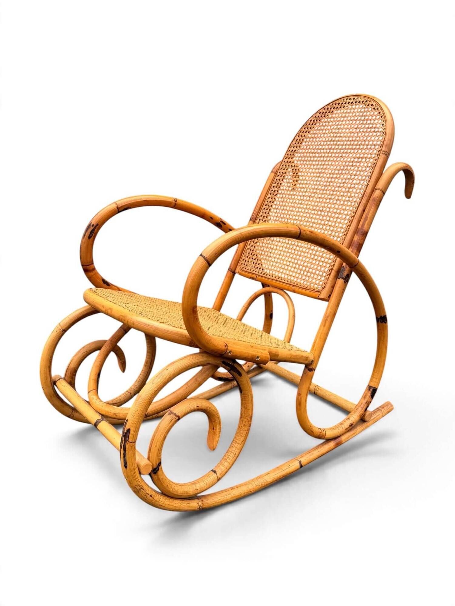 Vintage rocking chair in bamboo and cane