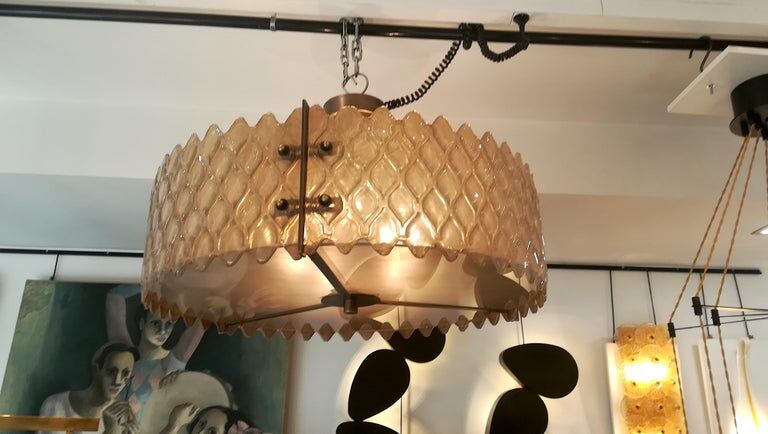 Patinated brass lurstre, and Murano glass