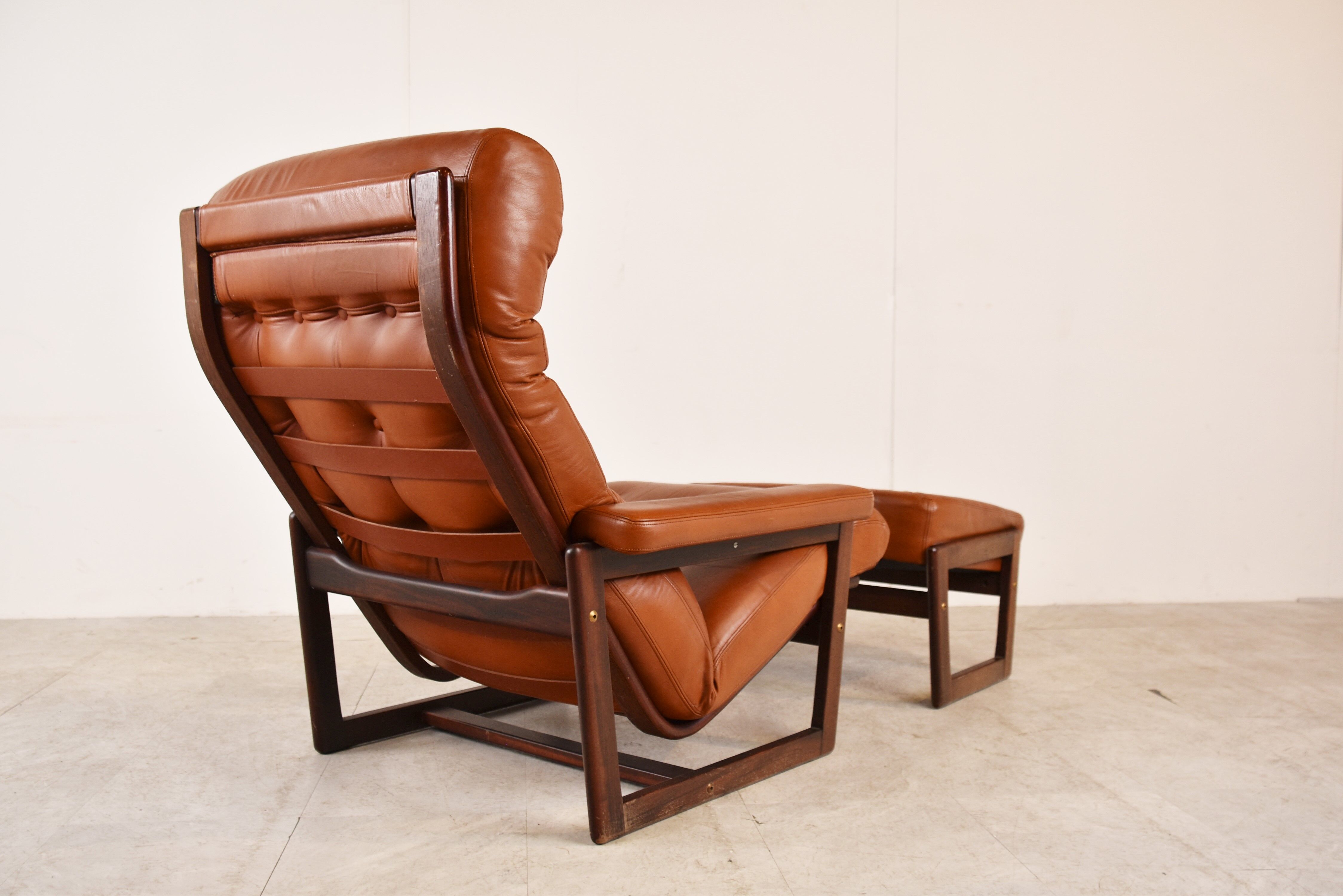 Vintage leather armchair with hocker, 1970s