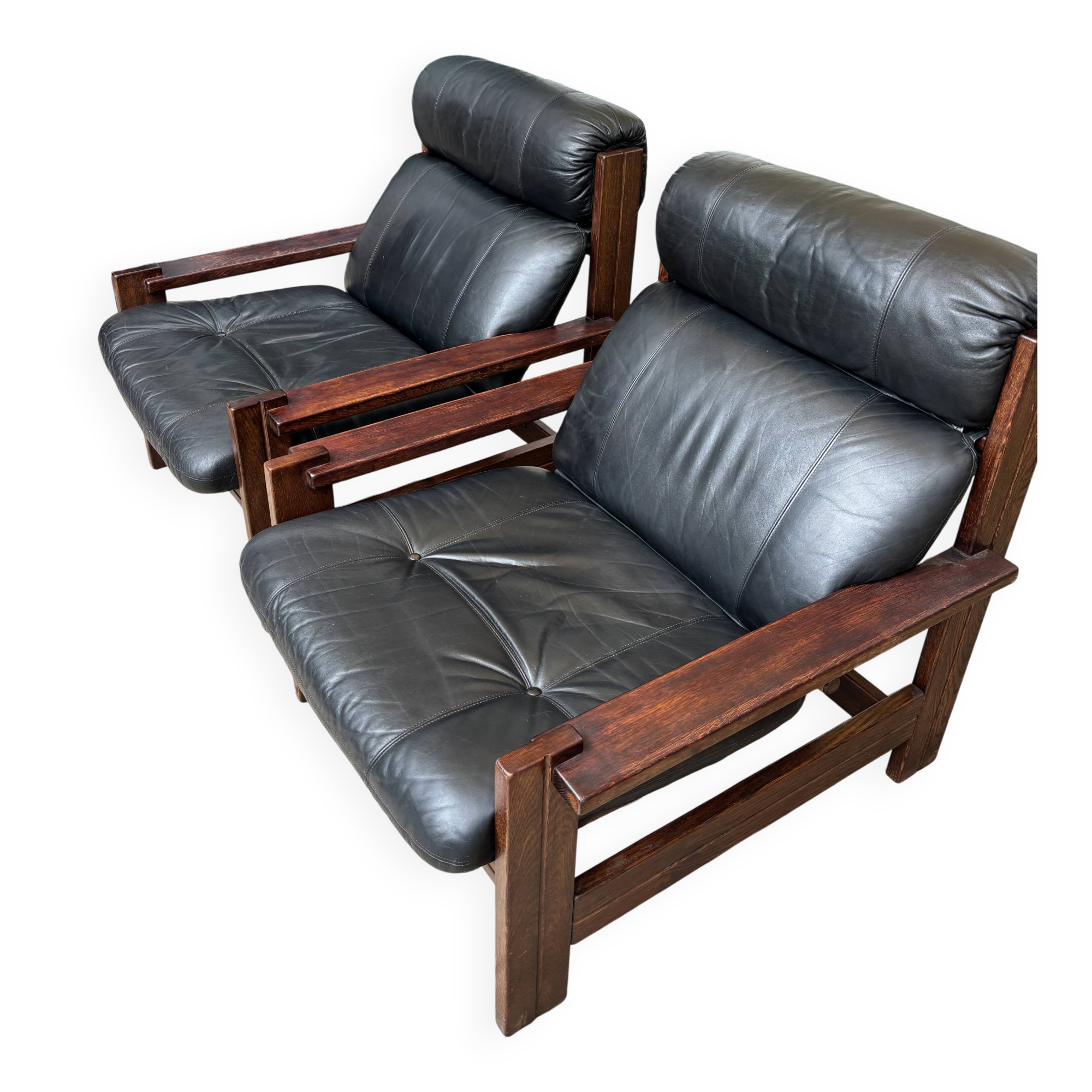 Vintage Scandinavian armchairs in leather and solid wood.