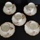 Series of five E. Bourgeois Paris porcelain coffee cups large deposit 1900
