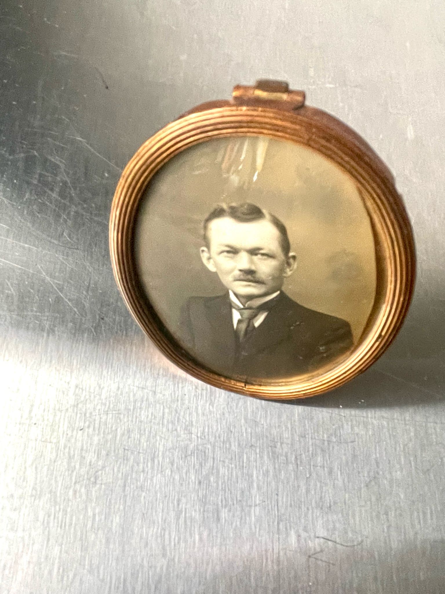 Metal gold colored oval picture frame brass