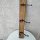 antique coat rack with 3 cast iron hooks