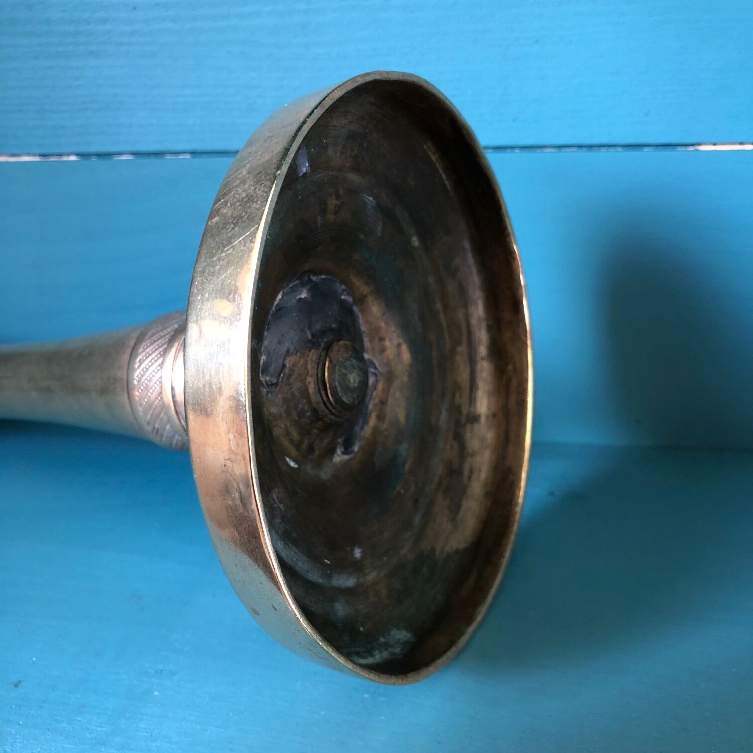 Large candlestick in chiseled brass