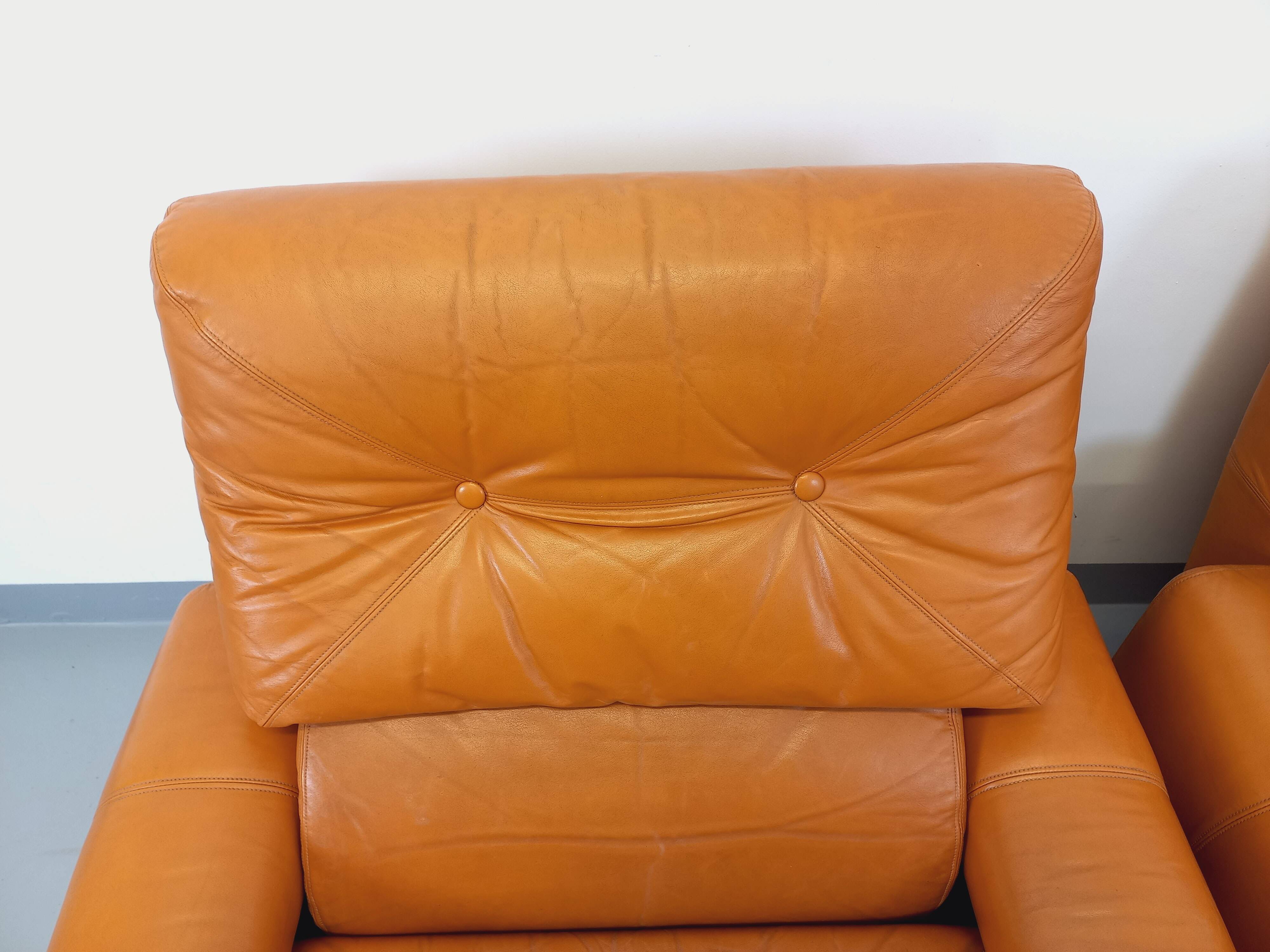 Pair of vintage leather lounge chairs from the 60s and 70s