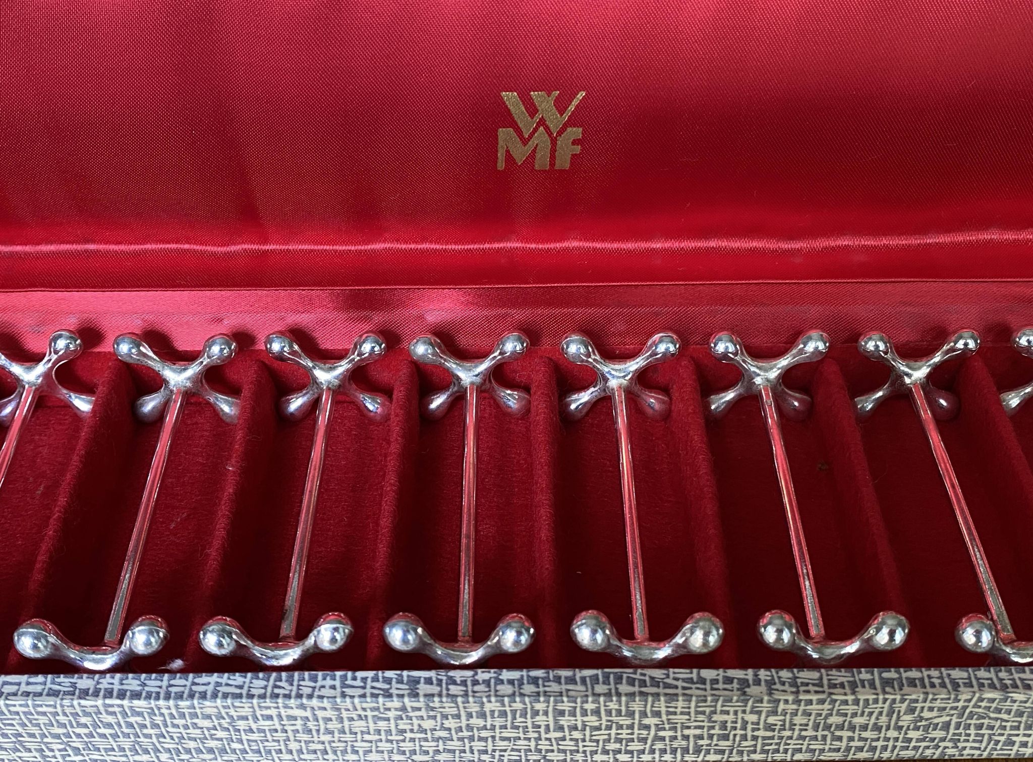 12 WMF silver-plated knife holders, boules model, in a box