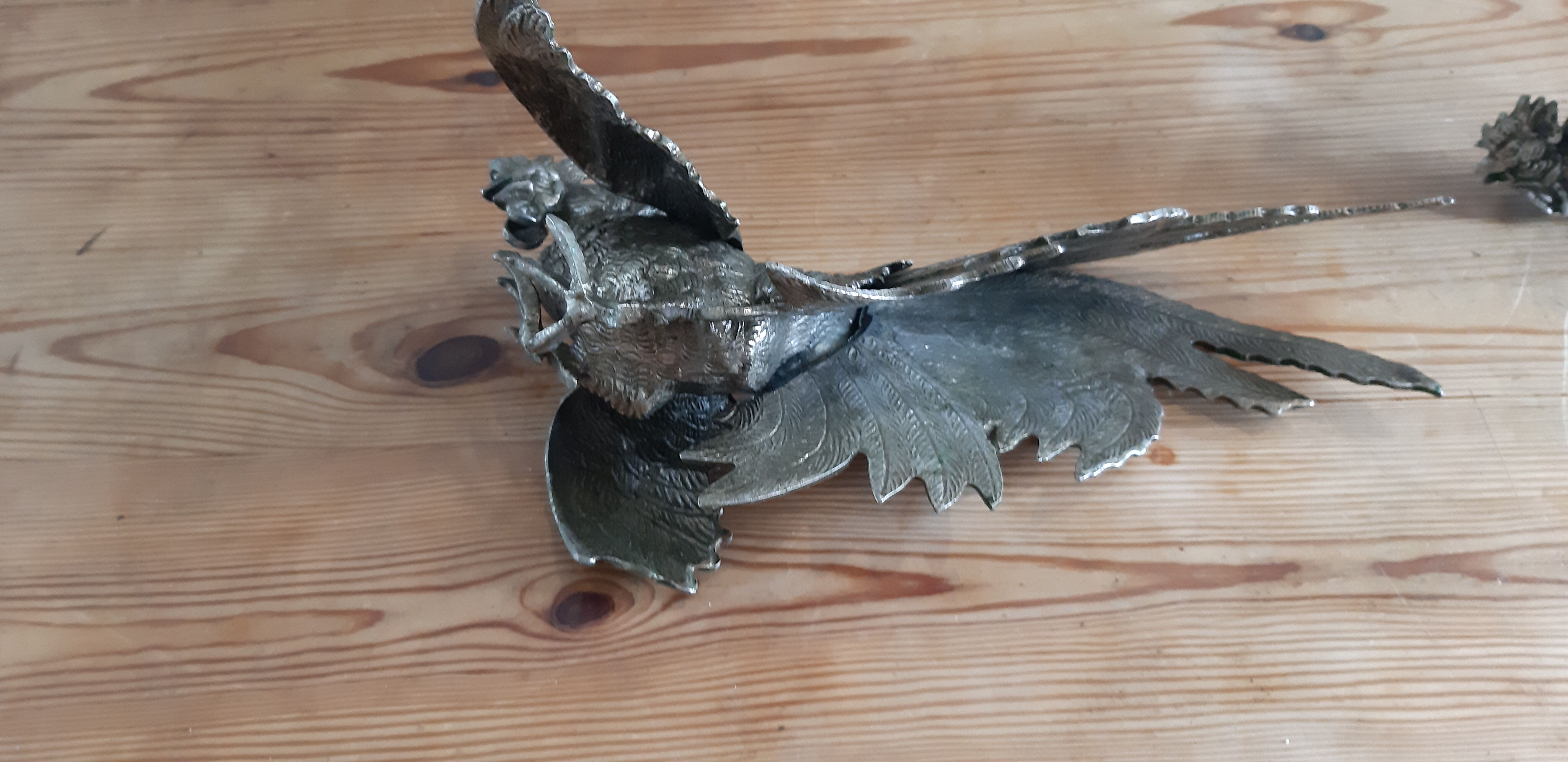 2 silver metal roosters