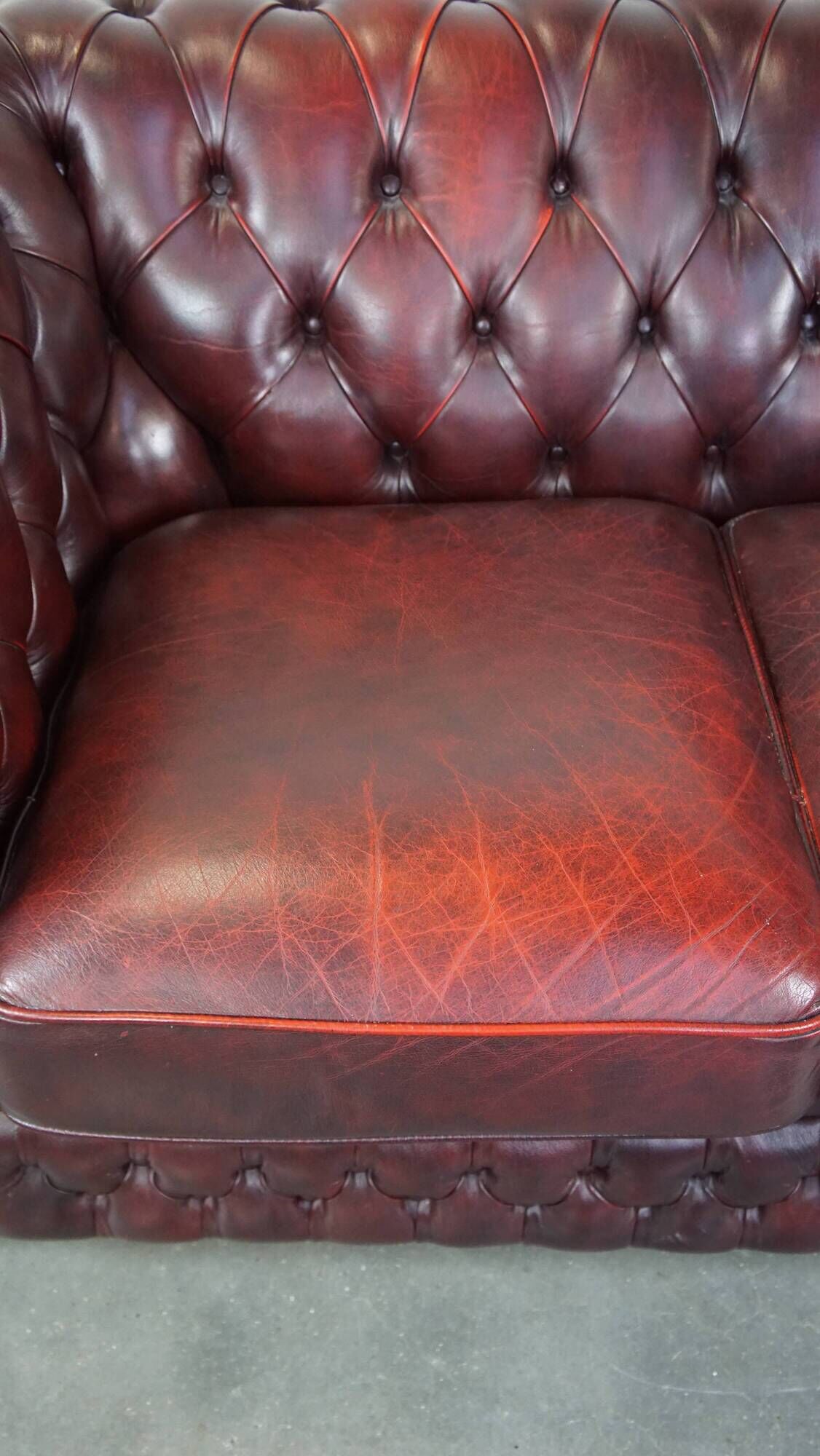 Original English Chesterfield sofa in red cowhide 2 seater