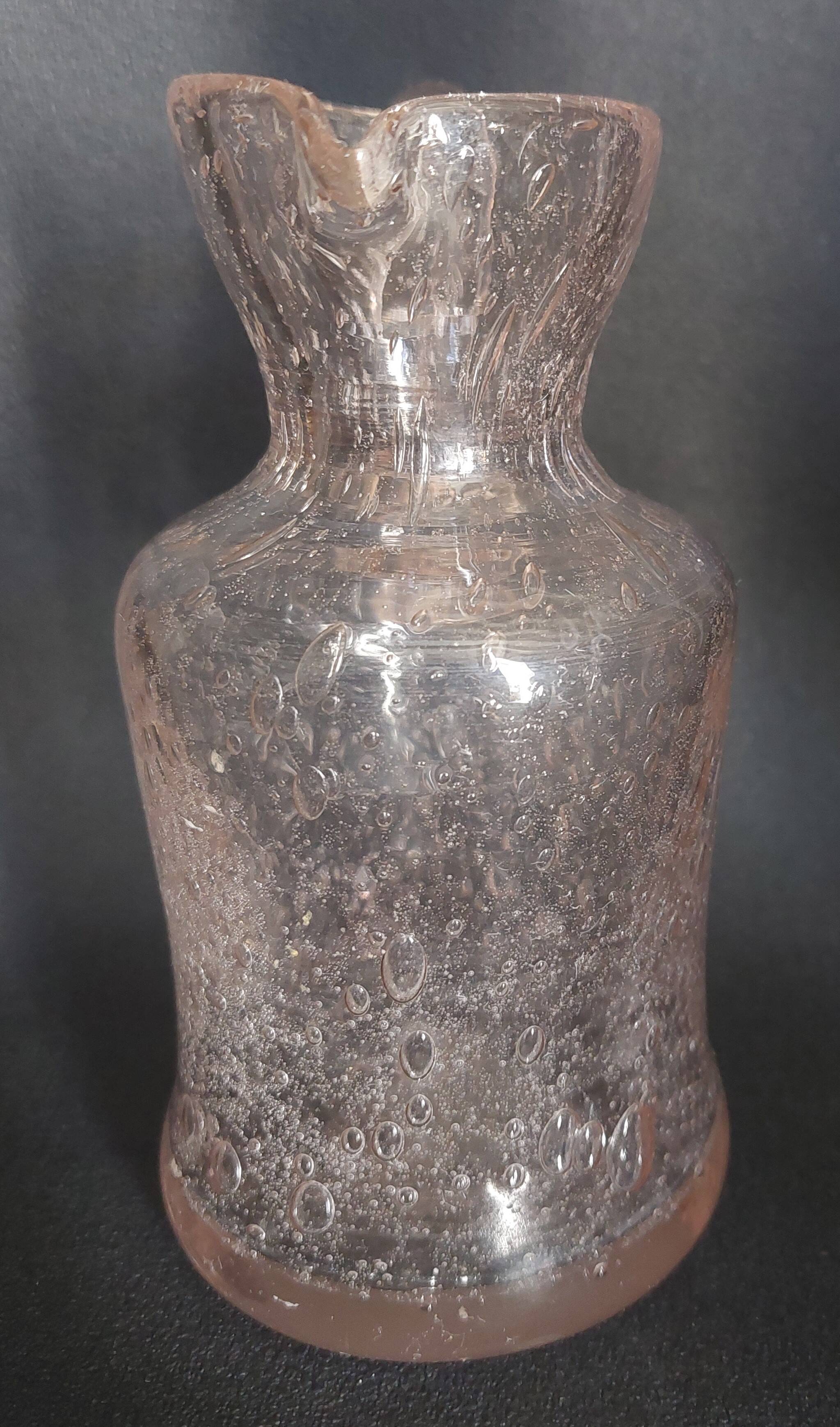 Small blown glass pitcher with bubbles from the 20th century.