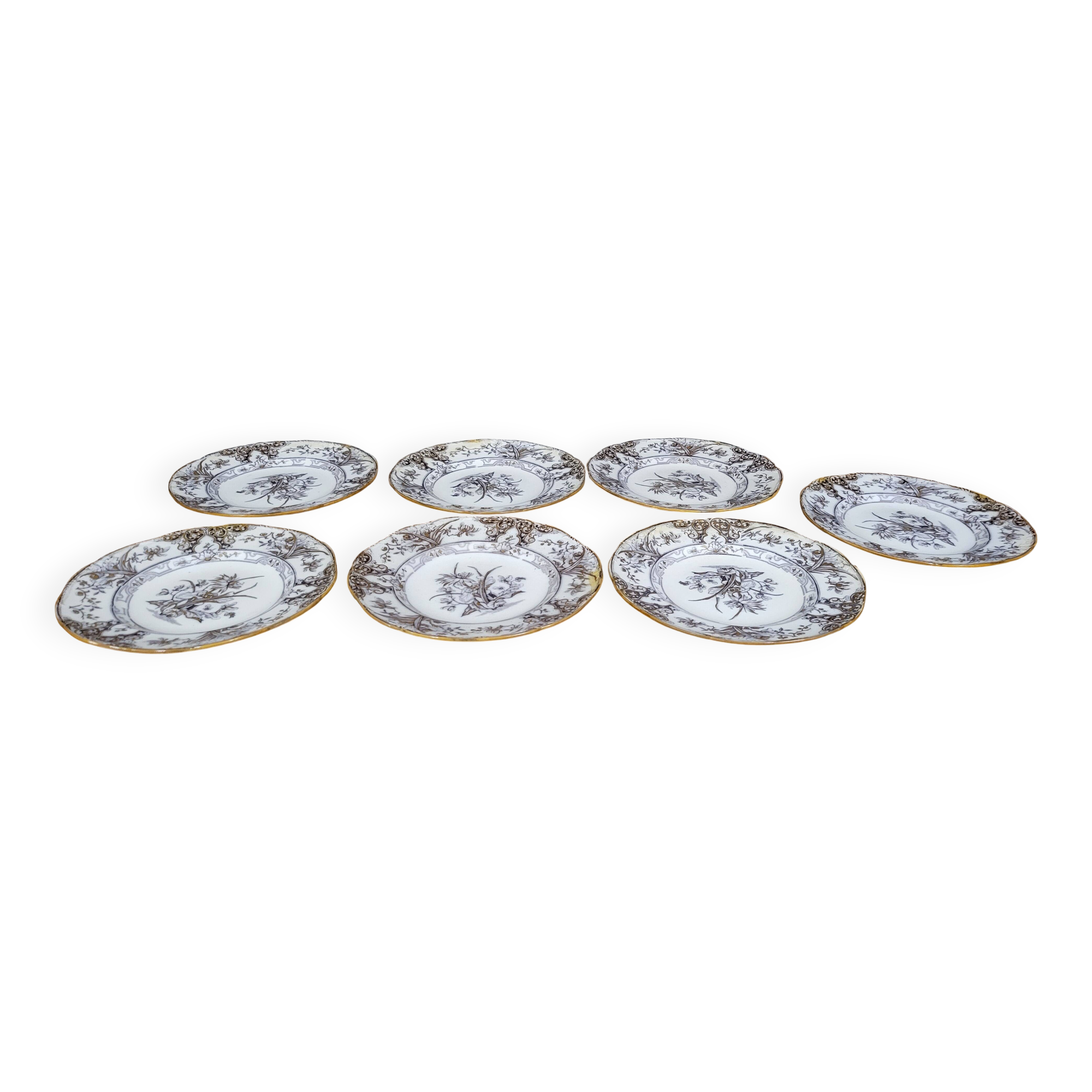 Set of 6 plates plus 1 in English porcelain, early 20th century