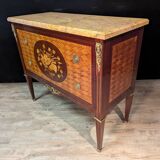 Louis XVI style commode inlaid with a decoration of instruments.