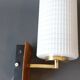 1960 wall light in gilded brass and rosewood.