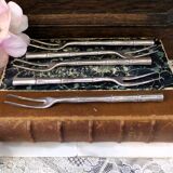 Five silver-plated metal appetizer forks with bamboo-style handles