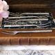 Five silver-plated metal appetizer forks with bamboo-style handles