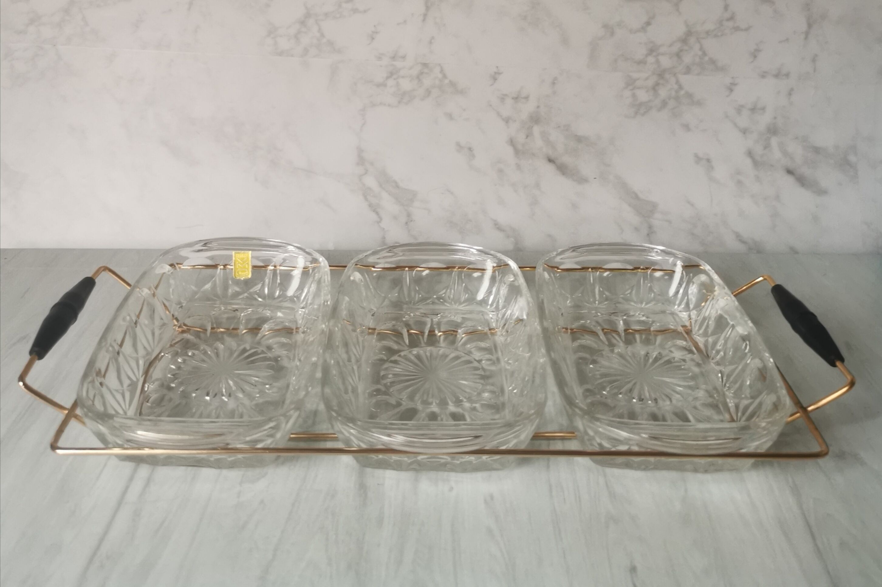 Tray with glass and gold metal compartments