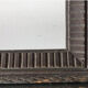 Antique wooden frame with geometric carvings light distress
