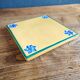 Yellow glazed ceramic trivet signed l. drimmer