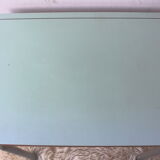 Green formica desk of water