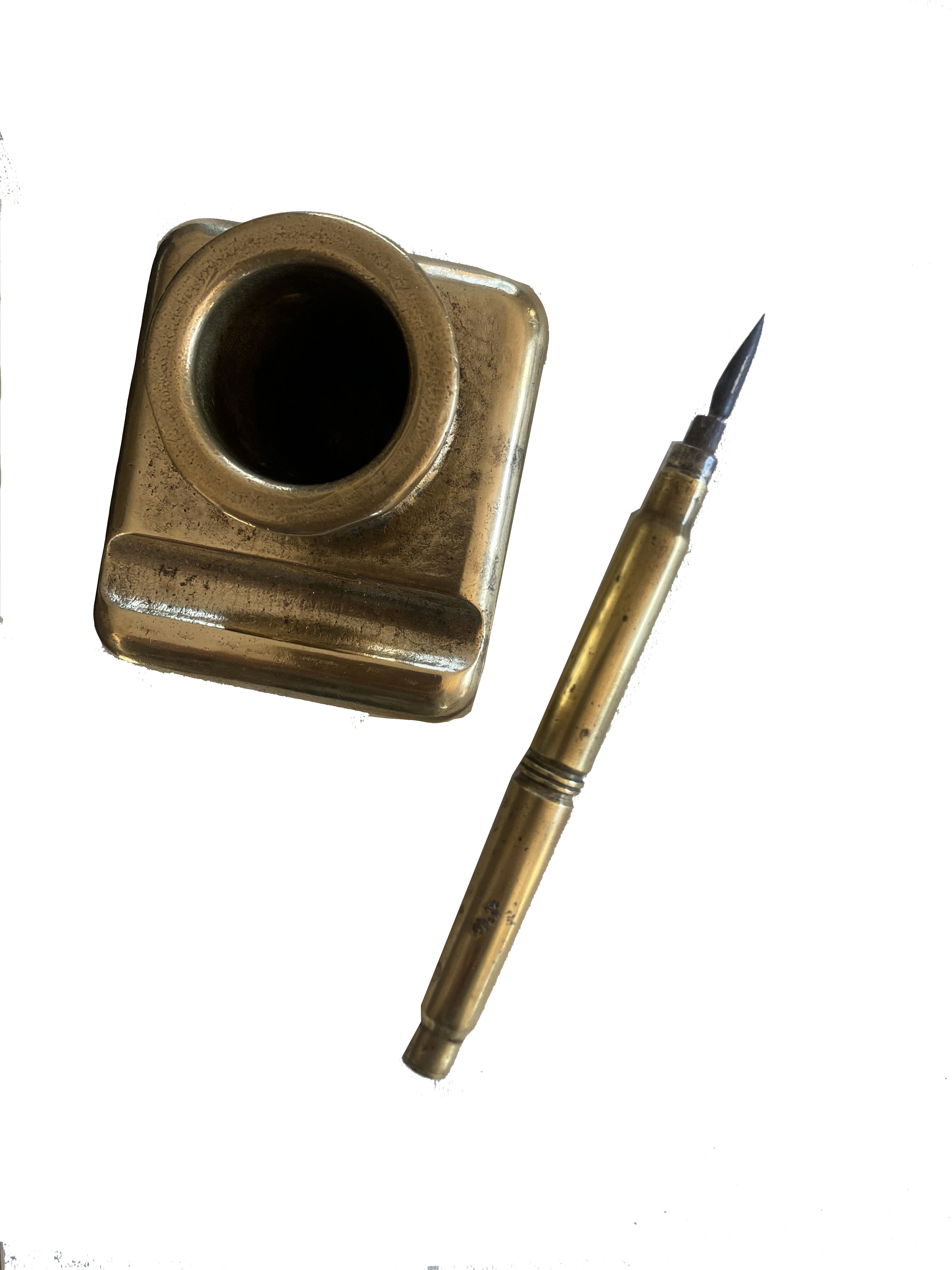 Brass inkwell and old feather holder