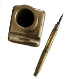 Brass inkwell and old feather holder