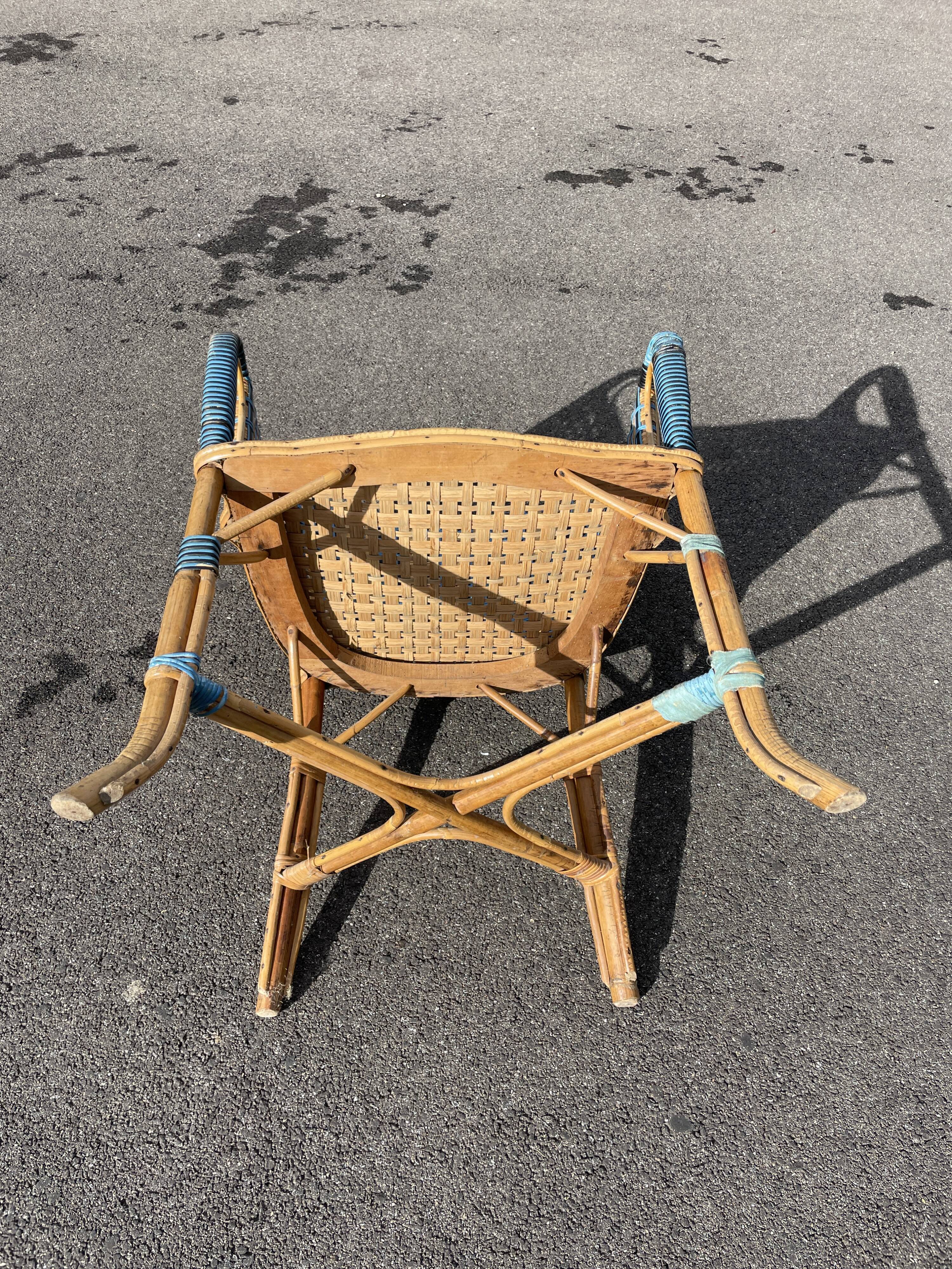 Old vintage woven and rattan wicker armchair 1930