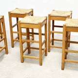 set of seven rattan and wood barstools