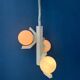Mid-century white suspension with a bony design and opaline glass shade.