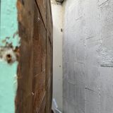 Large antique mercury mirror, patinated blue sculpted frame.