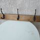 antique coat rack with 3 cast iron hooks