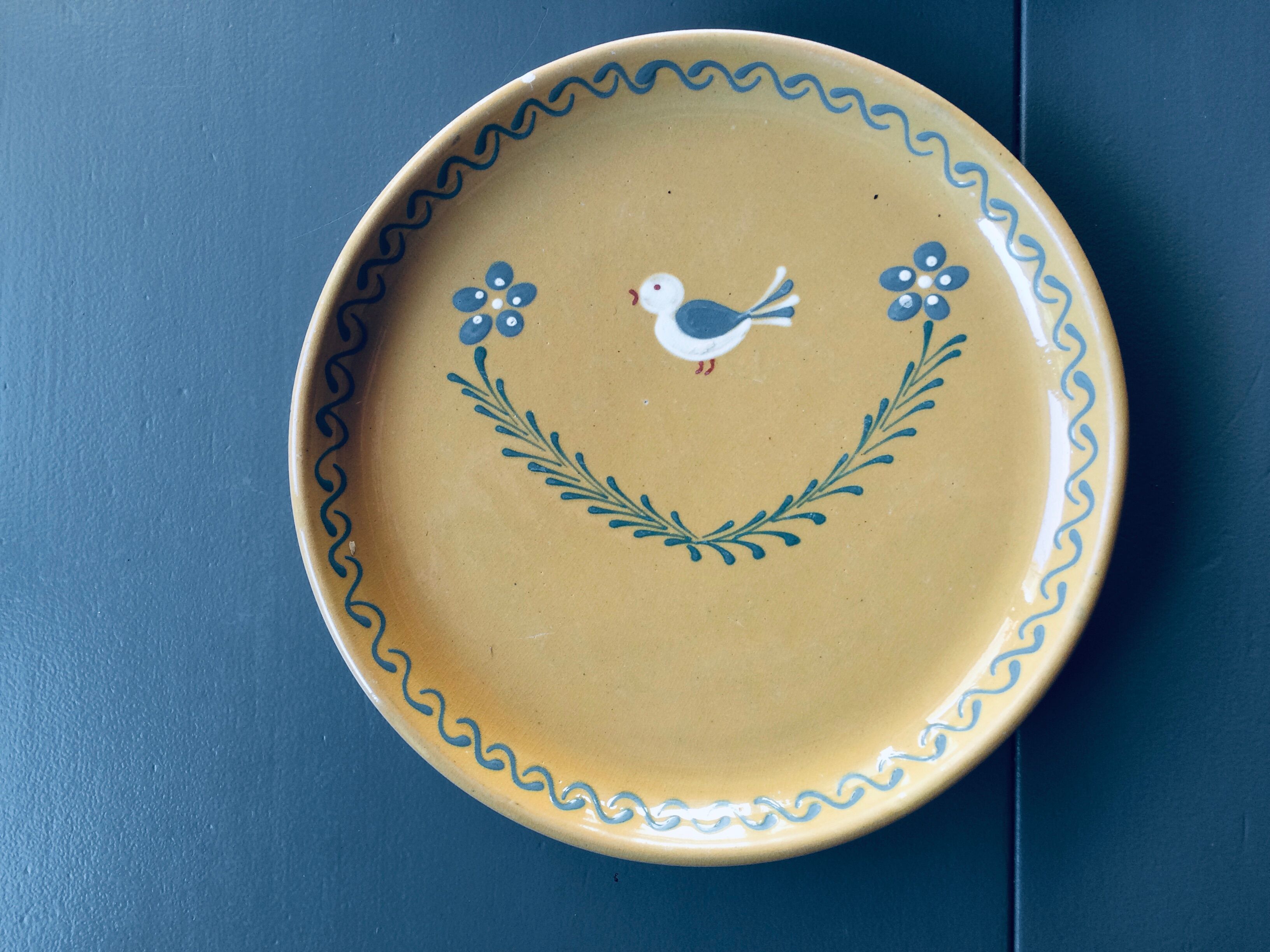 The six Piaf plates in painted terracotta