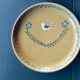 The six Piaf plates in painted terracotta