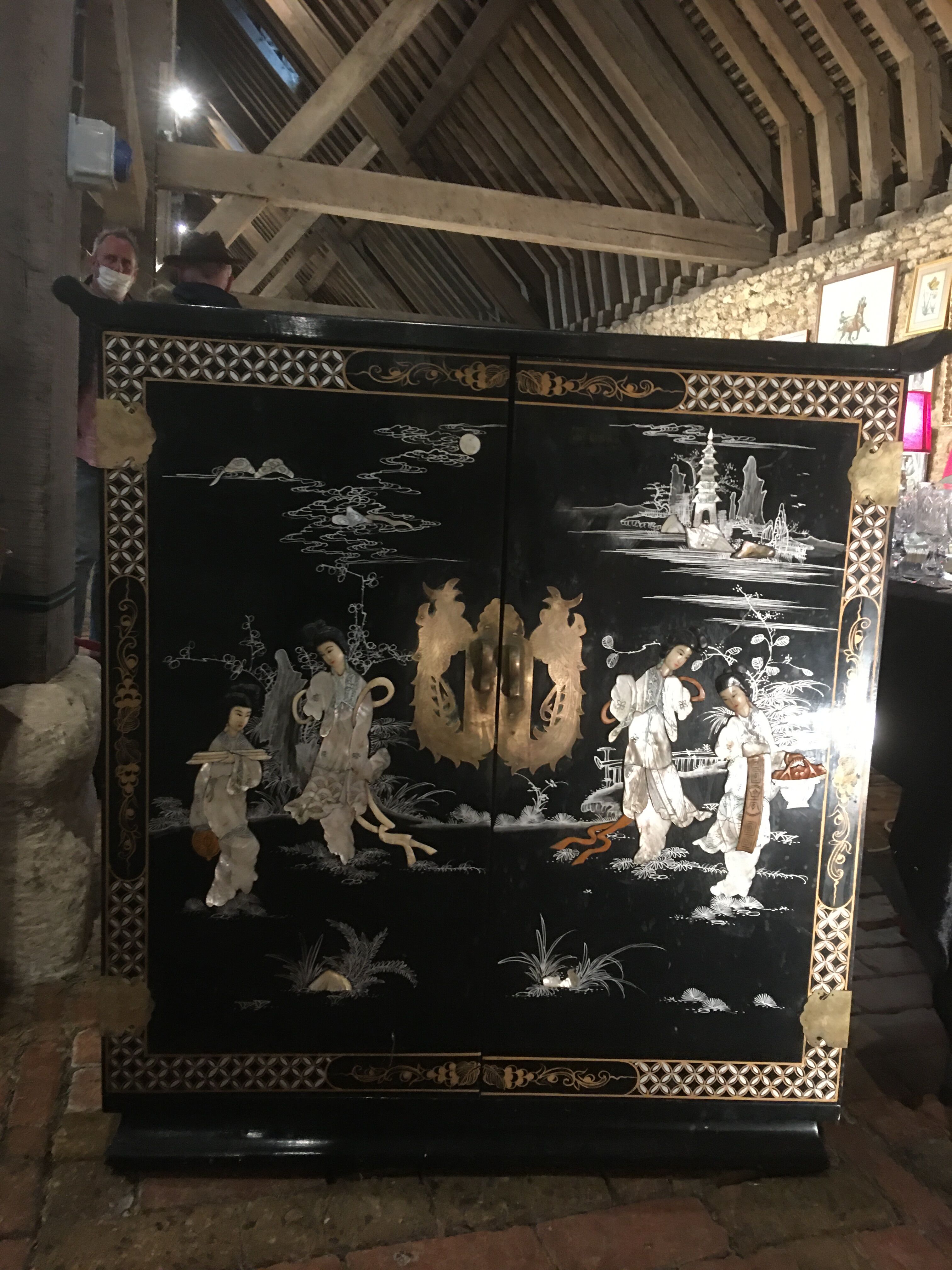 Asian lacquer cabinet with mother-of-pearl relief pattern