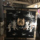 Asian lacquer cabinet with mother-of-pearl relief pattern