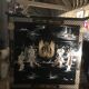 Asian lacquer cabinet with mother-of-pearl relief pattern