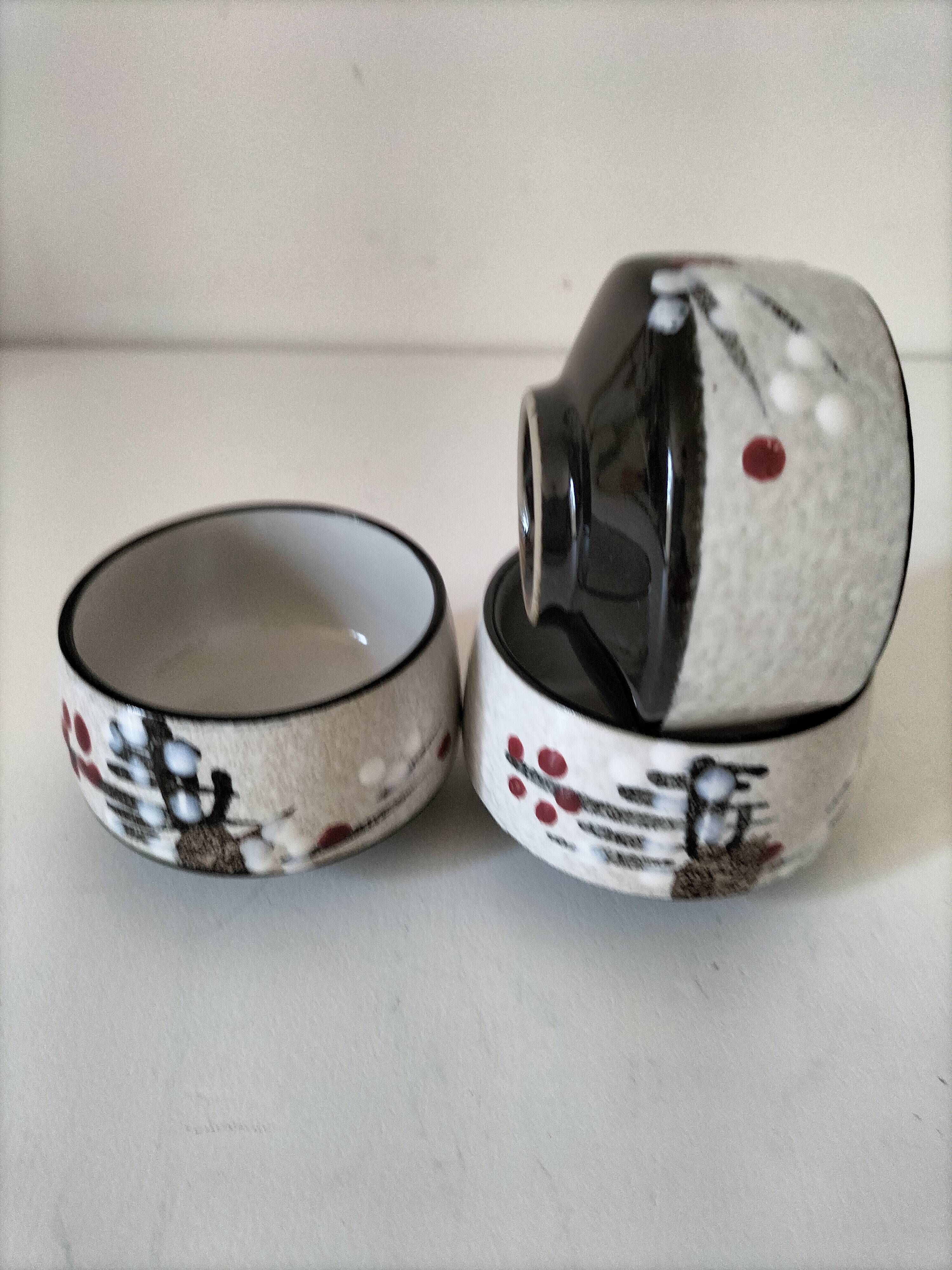 Three glazed ceramic bowls with raised graphic decoration, 1970s.