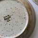 7 speckled stoneware plates