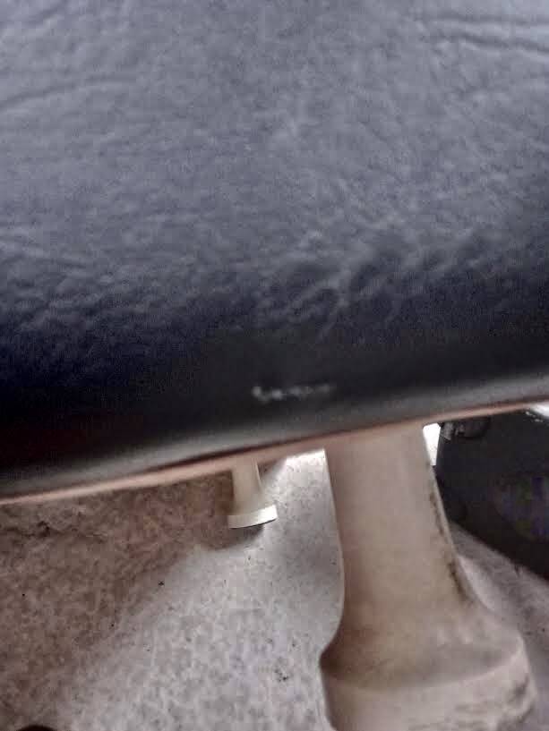 Pair of “space age” low chairs. Black faux leather. Circa 1970