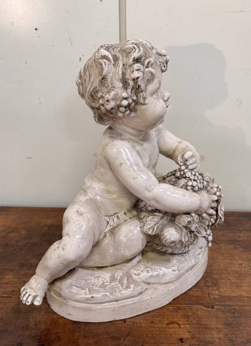 Lebrun: Glazed terracotta putti