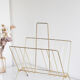 Vintage magazine holder in gold metal