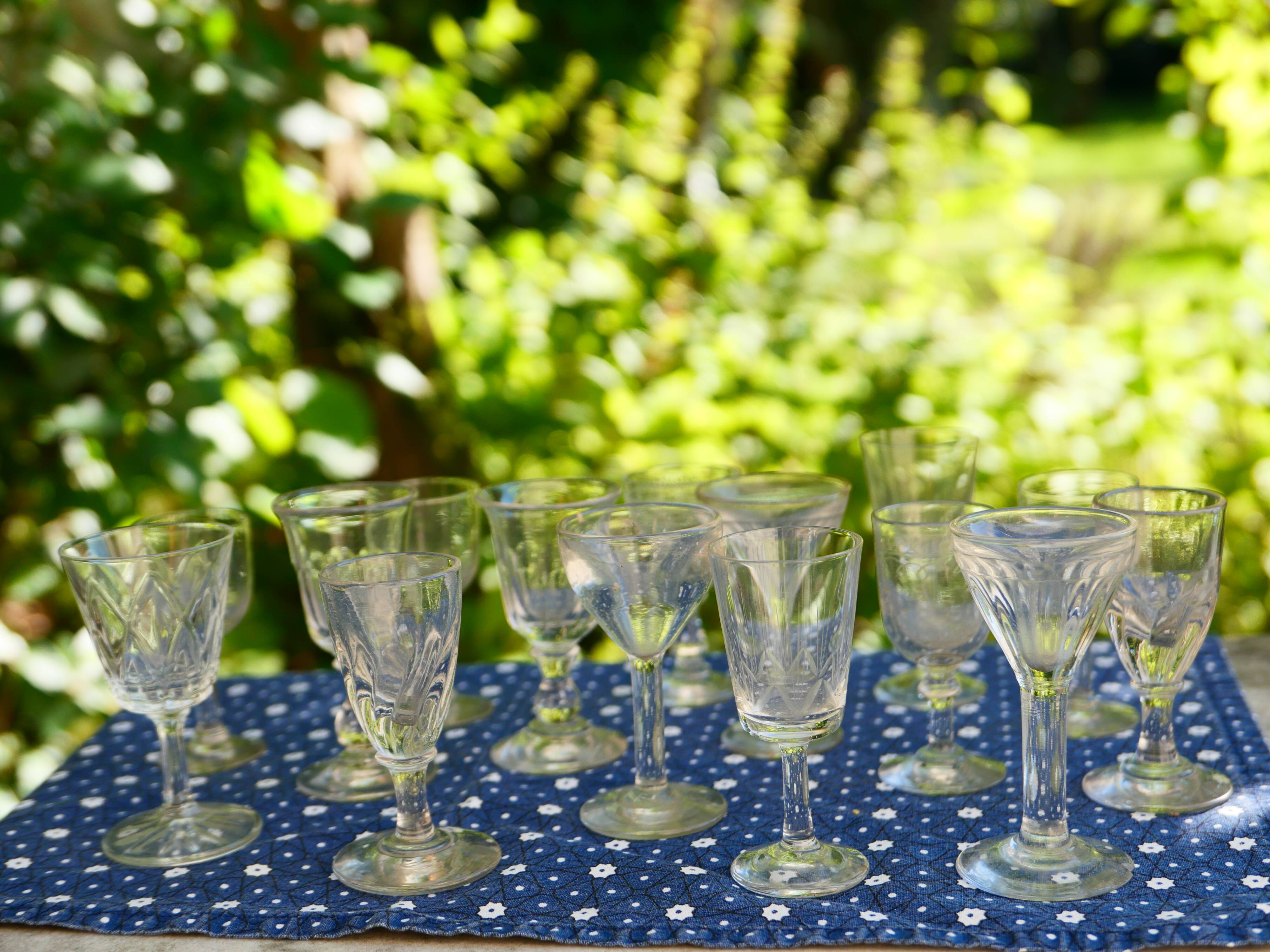 Assortment of 15 mismatched vintage liqueur glasses