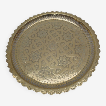 Old round oriental tray in serrated brass