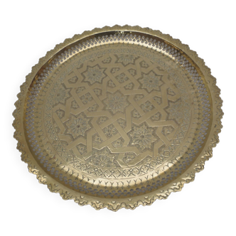 Old round oriental tray in serrated brass