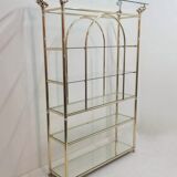 Hollywood Regency brass and glass shelf with elephant heads from the 1970s
