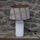 White ceramic lamp with tartan shade – cozy and timeless style
