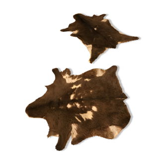 Set of two skins of Brown and white goat
