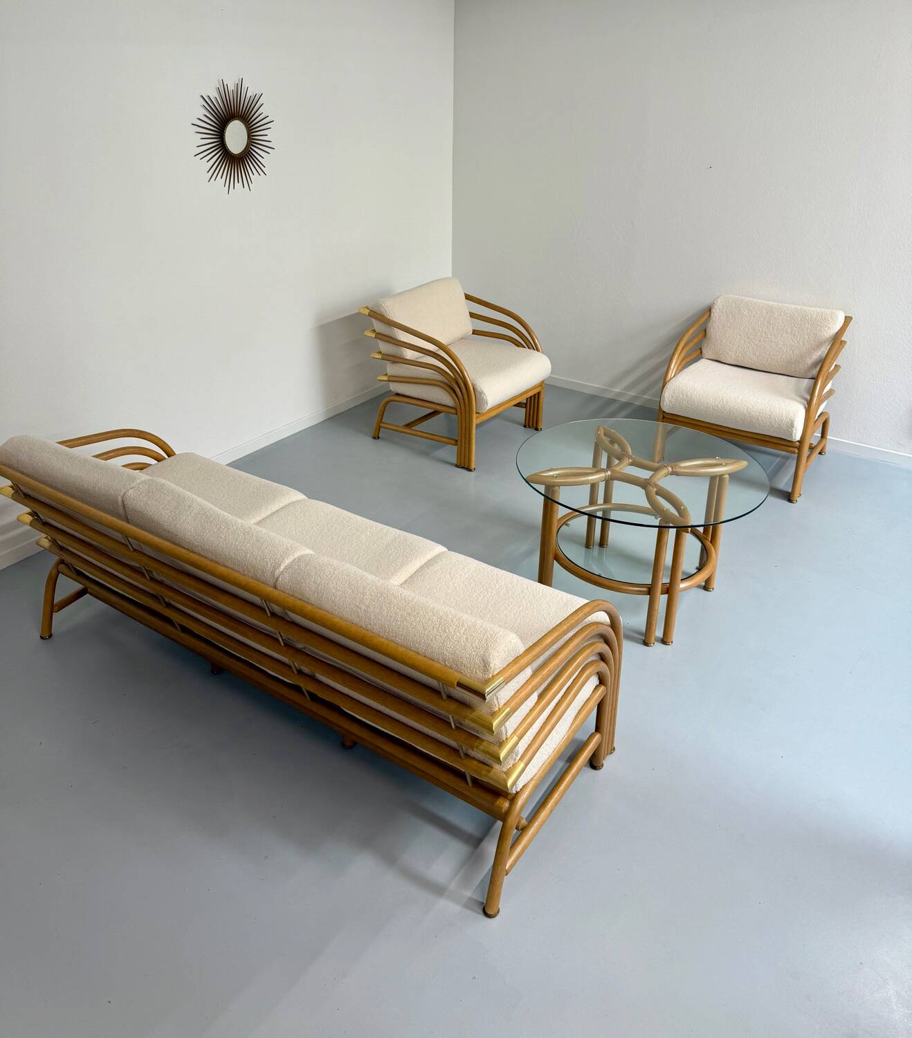 Complete living room with rattan sofa and white bouclette, brass finish, 80's design